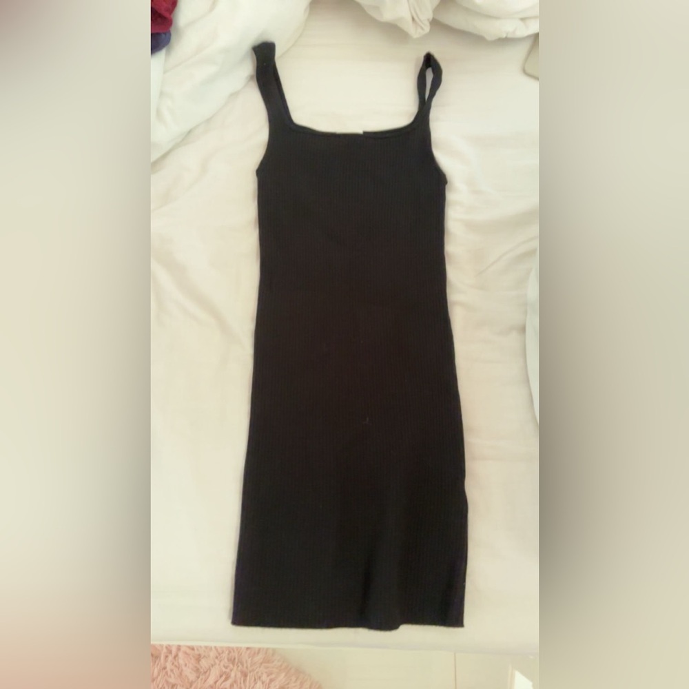 This dress is a black mini dress from aritiza size s very stretchy